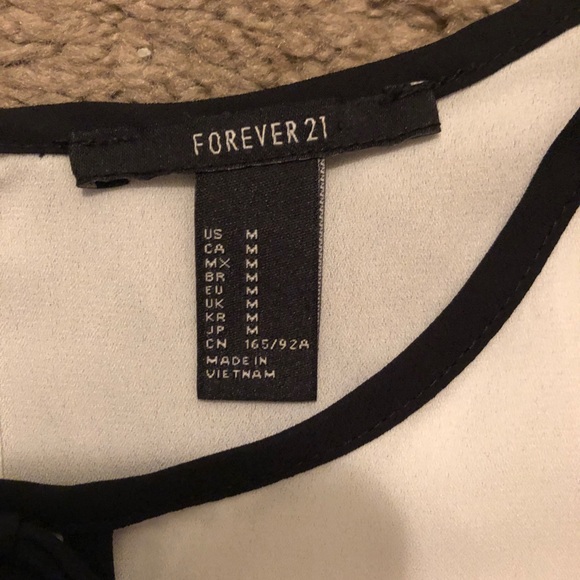 White blouse with black tie in front - Picture 2 of 4